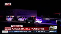 Police, fire crews respond to house fire in Phoenix