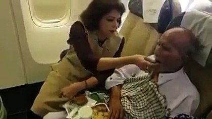 Watch how this PIA air hostess feeding an elderly with her own hands