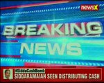 Siddaramaiah caught distributing cash; ECI examining the matter