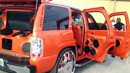 Hot Girl In Orange Pants On Orange Chevy.