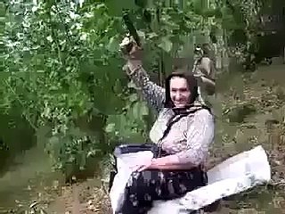 Old woman firing on Pistol