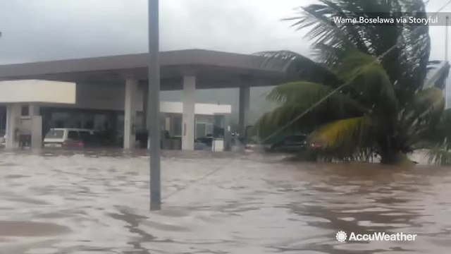 Fiji roads and buildings flooded by deadly cyclone