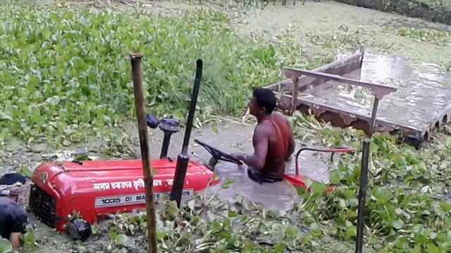 Funny Tractor Driver - Tractor stuck in Marsh