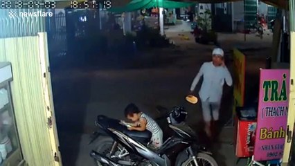 Moment brazen thief steals phone straight out of child's hands