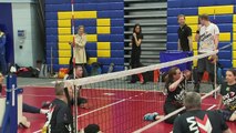 Prince Harry throws a ball at volleyball trials