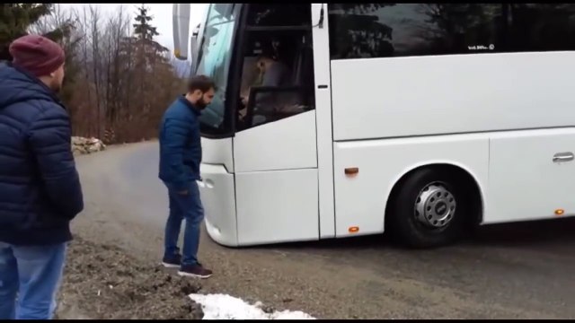 bus finds itself stuck in a mountain bend