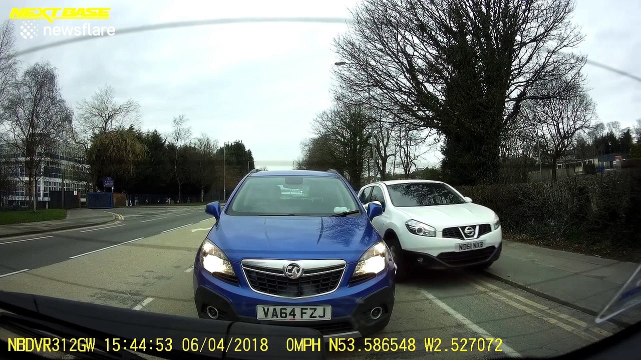 Car mounts pavement and speeds down footpath to undertake vehicles stuck in traffic
