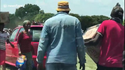 Looters in South Africa steal crashed lorry's washing powder