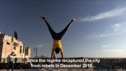 Youths bring parkour to Syria's war-battered east Aleppo