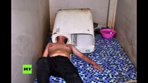 Un chino queda atrapado en una lavadora