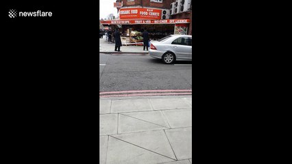 Police cordon off road after East London stabbing
