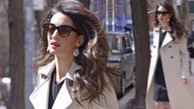 Amal Clooney cuts a chic figure in LBD and cream coat as she steps out in New York City.