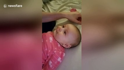 Too cute! Baby attempts to sing along with mother