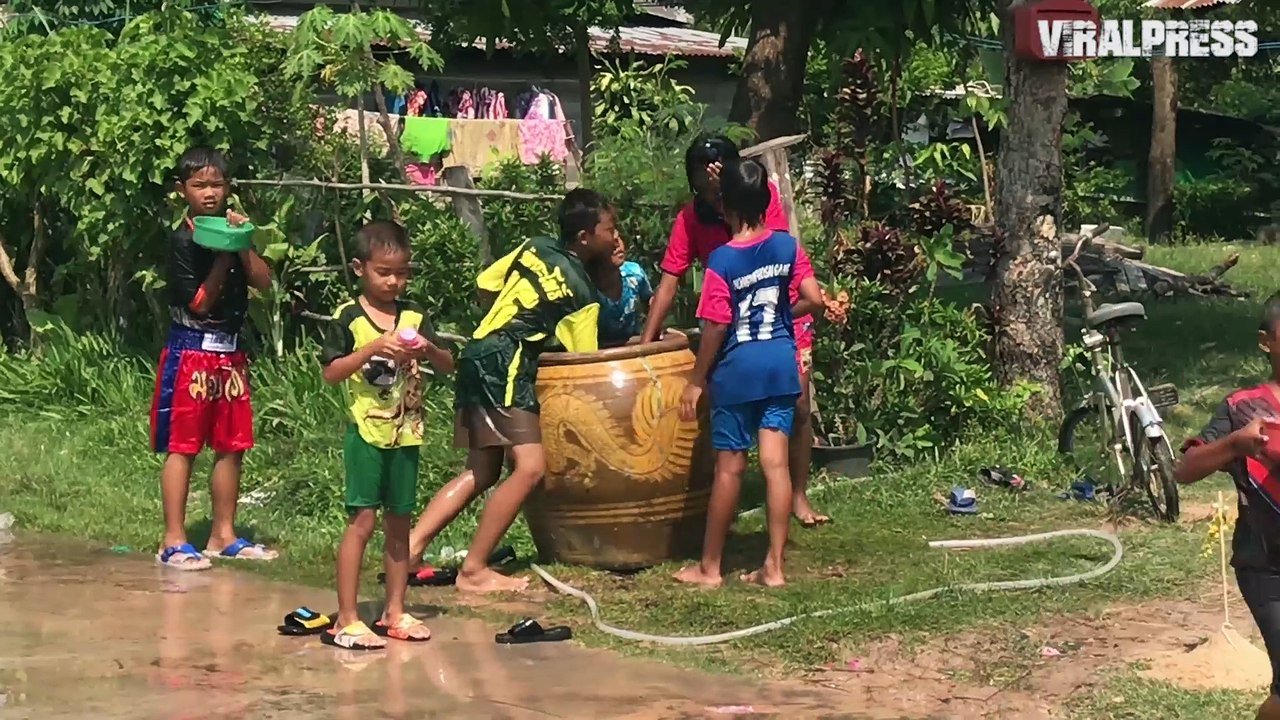Children Splash Passers-By For Songkran Thai New Year
