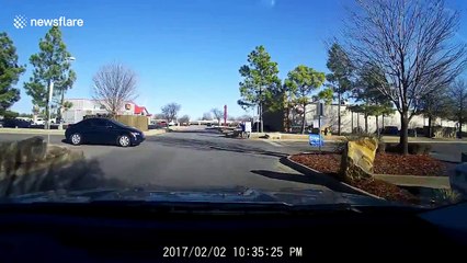 Passing pedestrians run for cover after sedan loses control in car accident