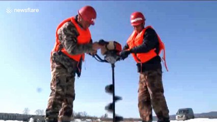 Dramatic video shows explosion of river ice to prevent flooding