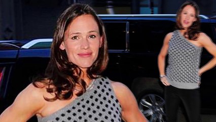 Jennifer Garner showcases toned arms in chic polka dot top and skin tight trousers for night out in New York City.