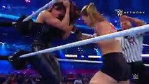ROUSEY VICTORIOUS AT WRESTLEMANIA.  In her WWE in-ring debut, Ronda Rousey lands a fury of punches to both Stephanie McMahon and Triple H. Rousey, alongside Kurt Angle, would go on to win the match.