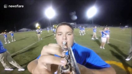 Hilarious marching band fail as high-school student trips up