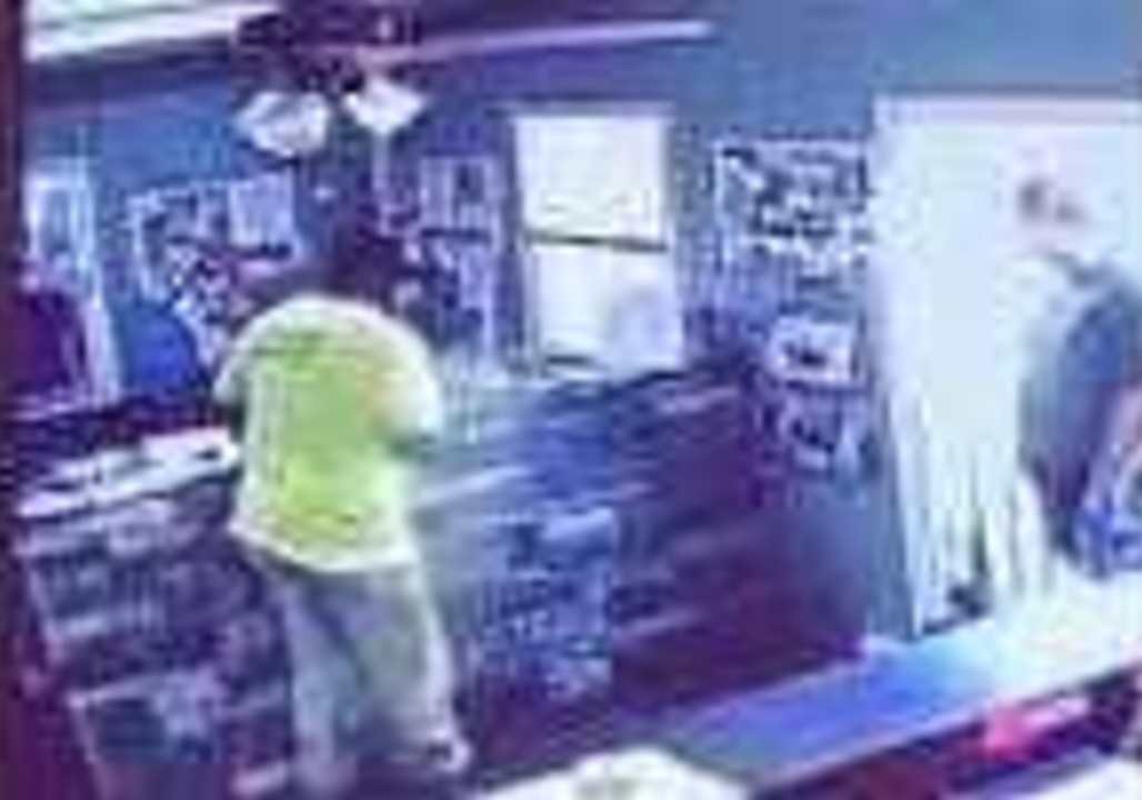 Scaredy-Cat Shopper Leaps for Safety After Spotting Feline Foe