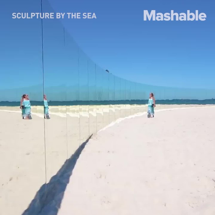 This beach is isolated by a wall of mirrors and it looks like a floating desert island