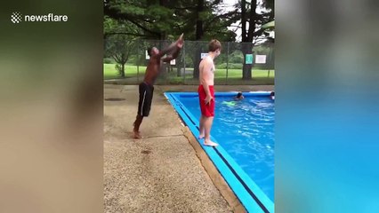 Self-styled 'parkour-gymnast' dives over friend standing beside pool