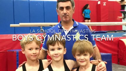 Boys’ Gymnastics Team Practicing On The Horizontal Bar