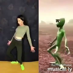 Green Alien dancing with a girl