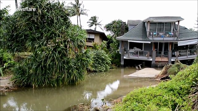Collapsed buildings and sunken homes: Floods devastate Hawaii's Kauai Island