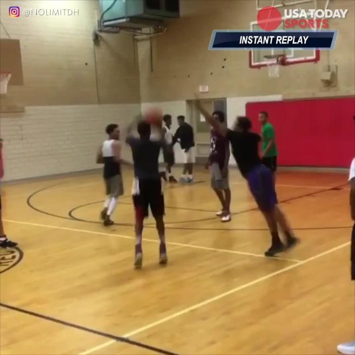 Hooper executes backflip while draining a three