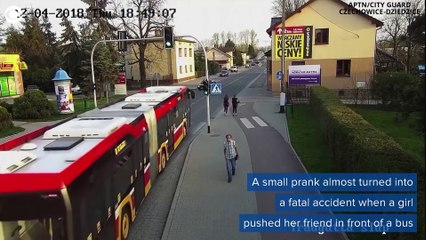 GIRL NEARLY KILLS FRIEND AFTER PUSHING HER INTO BUS FOR A LAUGH