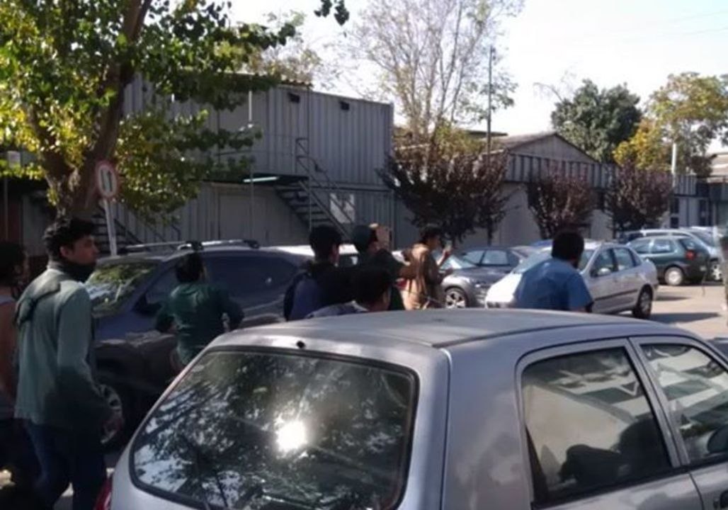 Santiago Students Run from Police Tear Gas During Education Protests