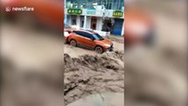 Cars swept away in heavy rain in northwest China