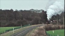 Steam Engine Pulling a Goods Train of Freight Wagons along a Country Railway Line