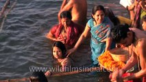 Hindu women bathe in the Ganges to observe Shivratri, Varanasi