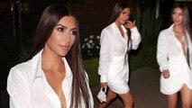 Kim Kardashian shows off cleavage and legs in white mini dress at her 20th high school reunion.