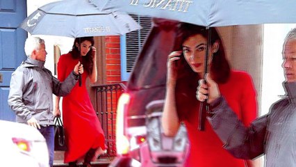 Amal Clooney grabs attention in scarlet red dress and lace-up heeled boots as she steps out in New York City