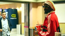 Snoop Dogg Dons Bob Marley Gear At LAX [2013]
