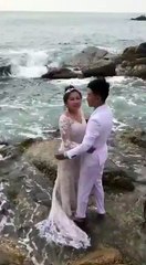 couple romance in beach and flood interrupt them.