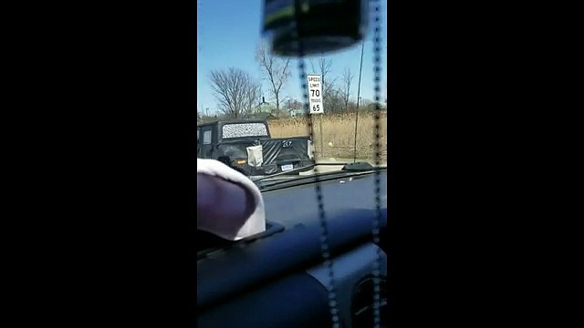 Jeep Wrangler Scrambler Pickup Caught In Motion On The Highway