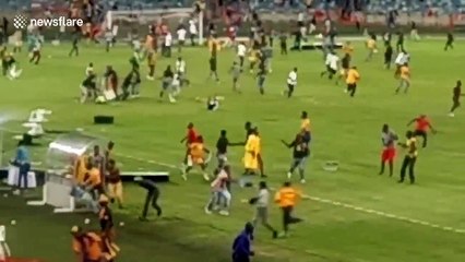 Shocking moment football fans riot on pitch after semi-final loss