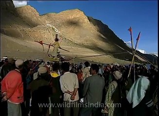 Kid performs dangerous tight rope walk, in the Himalaya