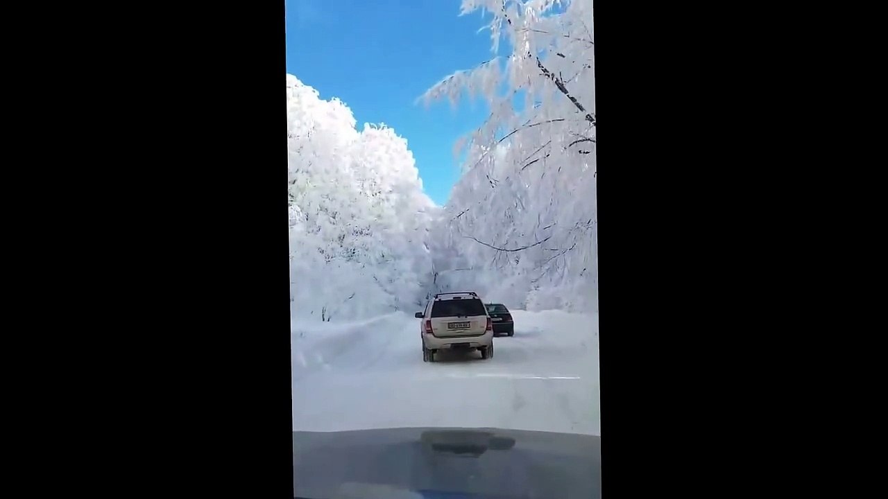 Driving car on Snow in Winter