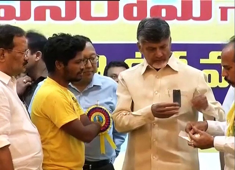 See how CM chandrababu Naidu humiliates dalit physical handicapped youth by rejecting sweet from his hand ll