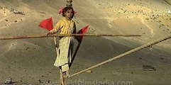 Kid performs dangerous tight rope walk, in the Himalaya