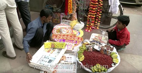 Man busily digs his nose and speaks on mobile - only in India