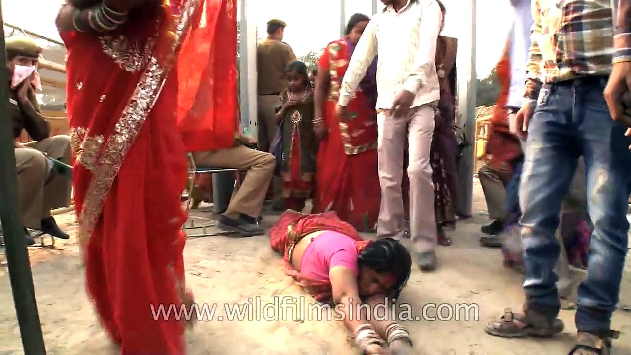 Female devotee crawls towards ghat during Chatt Puja