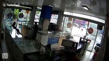 Dog drives three-wheeler into front of phone shop