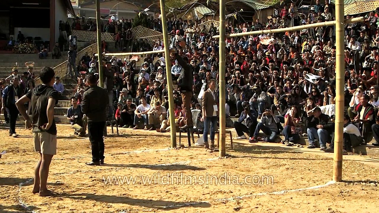 Naga boy kicks hard and falls on his head at meat-kicking competition