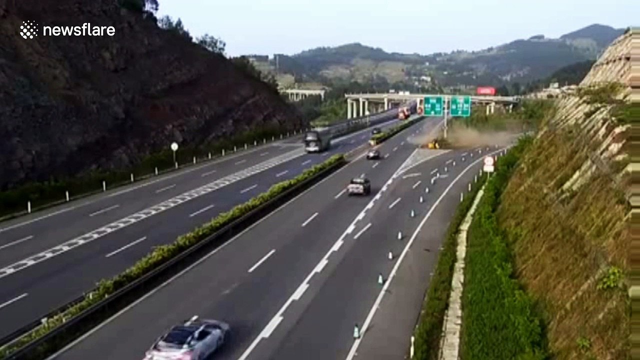 Car changing lanes crashes into embankment on motorway